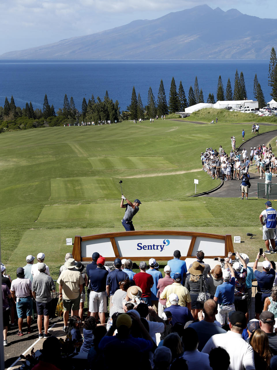 Bryson Dechambeau plays his shot from the first tee during the final round of the Tournament of Champions golf event, Sunday, Jan. 6, 2019, at Kapalua Plantation Course in Kapalua, Hawaii. (AP Photo/Matt York)