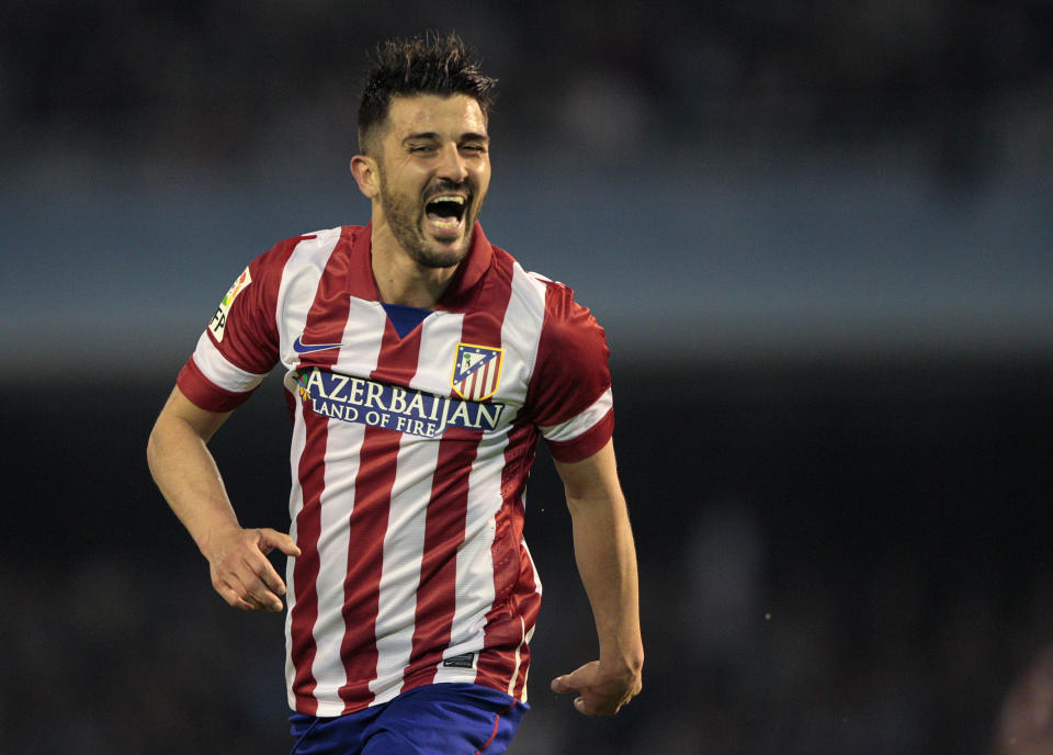 Atletico's David Villa celebrates scoring the first goal against Real Club Celta de Vigo during a Spanish La Liga soccer match at the Balaidos stadium in Vigo, Spain, Saturday March 8, 2014. (AP Photo/Lalo R. Villar)