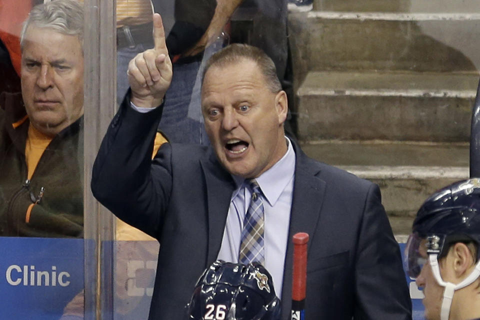 FILE - Then-Florida Panthers coach Gerard Gallant talks to the players during a timeout in the third period of Game 1 in a first-round NHL hockey Stanley Cup playoff series against the New York Islanders in Sunrise, Fla., in this Thursday, April 14, 2016, file photo. Gallant takes on a new challenge as coach of the New York Rangers, looking to "take a big step" with a young team that ownership and management thinks should be a contender. It's very different than his previous stints with expansion Vegas and Florida. (AP Photo/Alan Diaz, File)