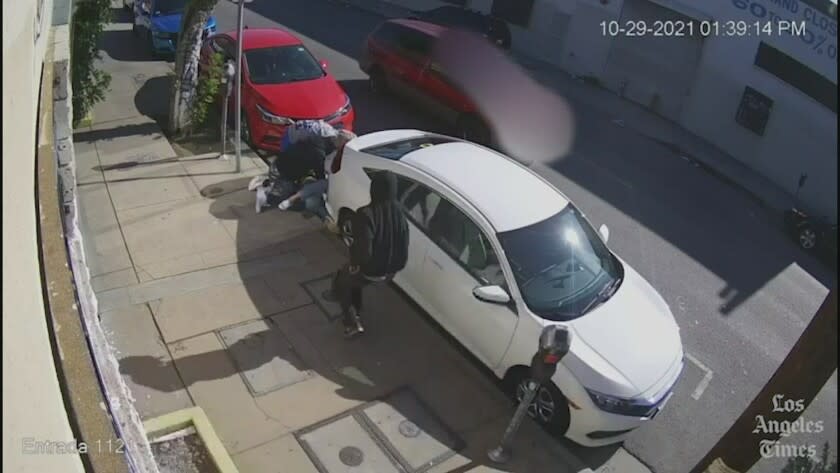 Surveillance video captured a man being chased down and robbed in October on a street in downtown Los Angeles.