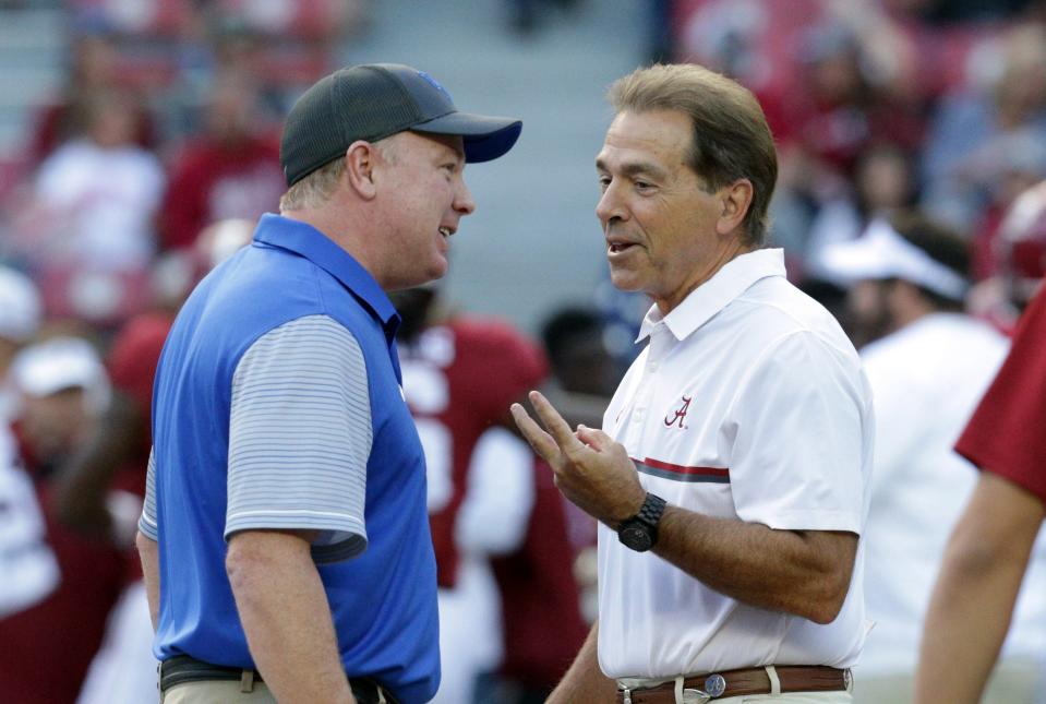 UK coach Mark Stoops talks with Alabama coach Nick Saban ahead of their meeting in 2016.