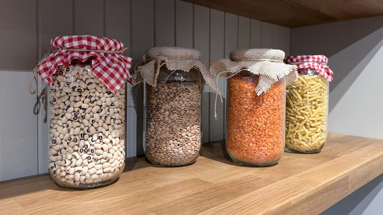 jars of lentils, beans, and pasta in pantry