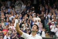 Serbia's Novak Djokovic celebrates winning the first round men's singles match against Britain's Jack Draper on day one of the Wimbledon Tennis Championships in London, Monday June 28, 2021. (AP Photo/Kirsty Wigglesworth)