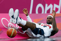 Lebron James #6 of United States falls to the ground after a play against France during their Men's Basketball Game on Day 2 of the London 2012 Olympic Games at the Basketball Arena on July 29, 2012 in London, England. (Photo by Jamie Squire/Getty Images)