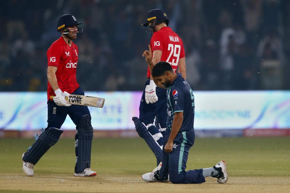 Pakistan's Haris Rauf, center front, celebrates after taking the wicket of England's Phil Salt, left, during the fifth twenty20 cricket match between Pakistan and England, in Lahore, Pakistan, Wednesday, Sept. 28, 2022. (AP Photo/K.M. Chaudary)