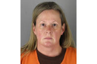 This booking photo released by the Hennepin County, Minn., Sheriff shows Kim Potter, a former Brooklyn Center, Minn., police officer who is charged Wednesday, April 14, 2021, with second-degree manslaughter for killing 20-year-old Black motorist Daunte Wright in a shooting that ignited days of unrest and clashes between protesters and police. (Hennepin County Sheriff via AP)