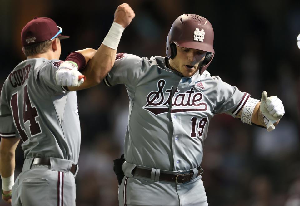 Mississippi State Bulldogs Logan Tanner (19) celebrates his homerun with teammate Riley Self (14) against the Memphis Tigers during their game at AutoZone Park on Tuesday, March 29, 2022.  