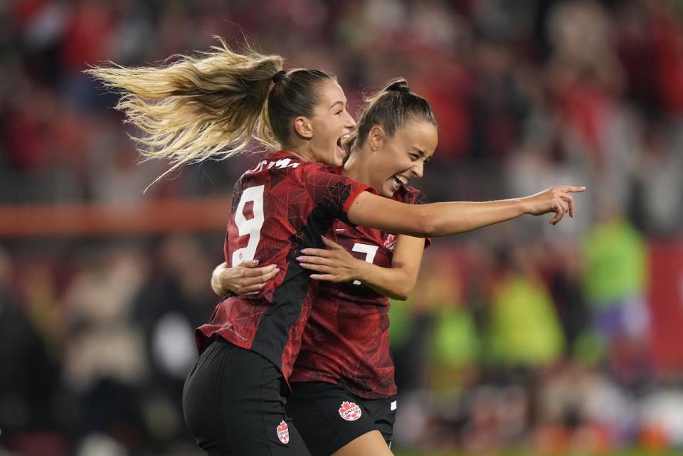 Canada's Jordyn Huitema, left, celebrates her second-half goal with teammate Julia Grosso during a 2-1 win over Jamaica on Tuesday in Toronto. (Nathan Denette/The Canadian Press - image credit)