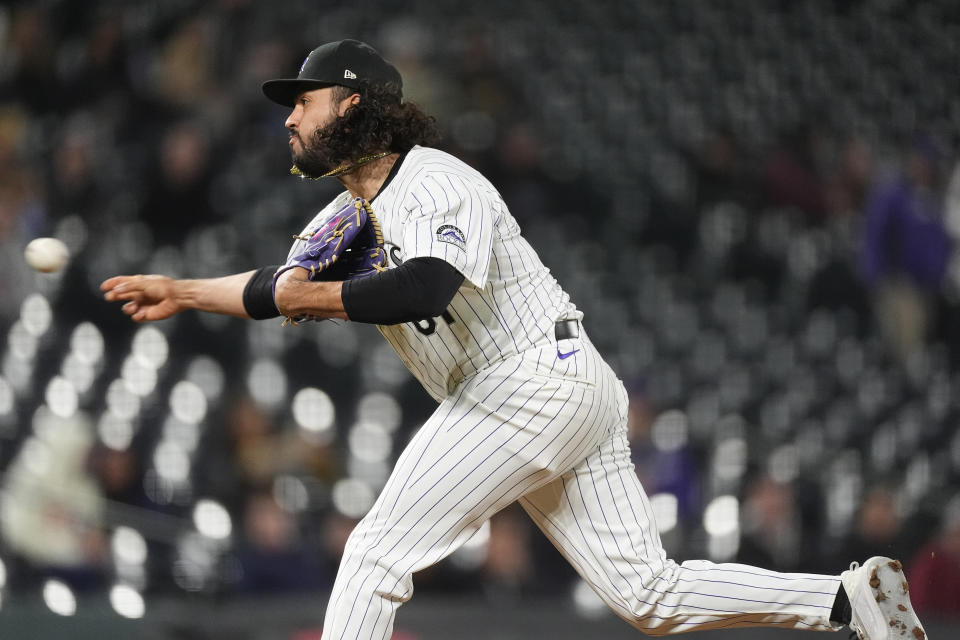 Colorado Rockies relief pitcher Justin Lawrence works against the San Diego Padres during the ninth inning of a baseball game Tuesday, April 23, 2024, in Denver. (AP Photo/David Zalubowski)