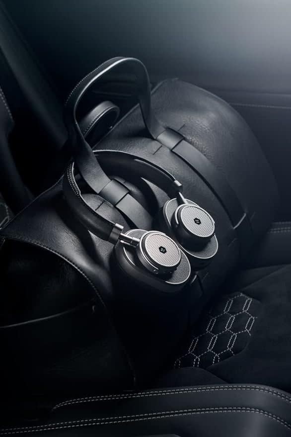 a pair of black headphones on a black car seat