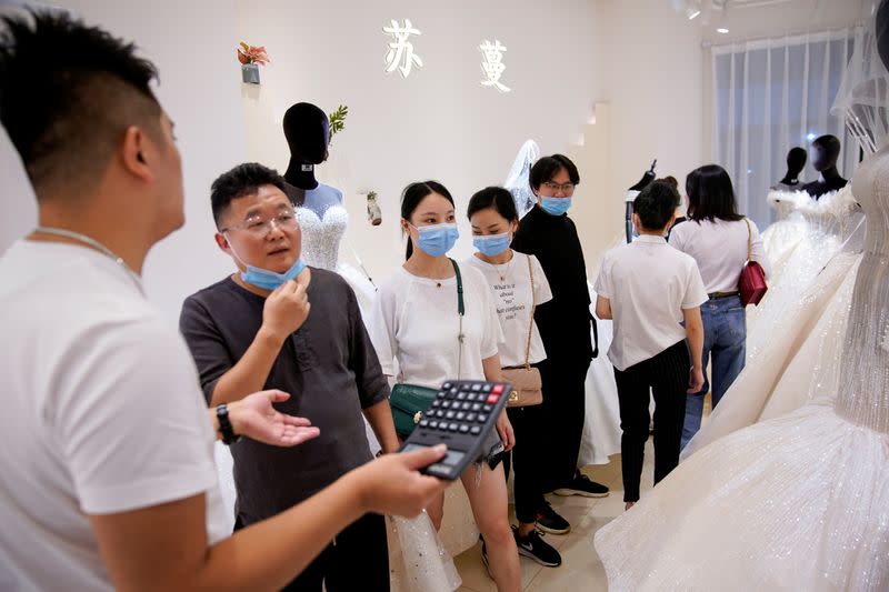 The Wider Image: Coronavirus dampens celebrations in China's wedding gown city