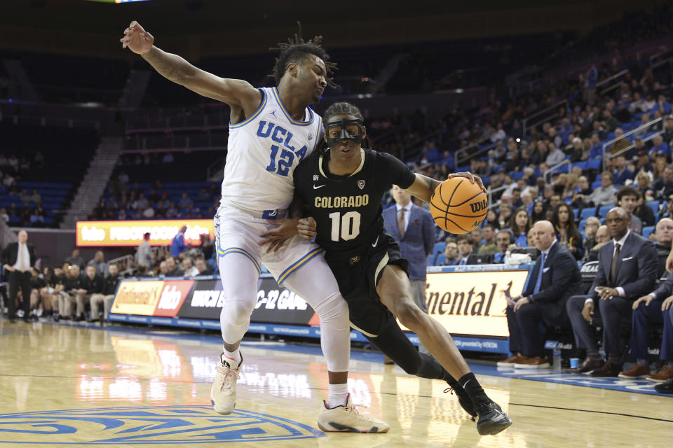 Colorado forward Cody Williams (10) drives to the basket against UCLA guard Sebastian Mack (12) during the first half of an NCAA college basketball game Thursday, Feb. 15, 2024, in Los Angeles. (AP Photo/Raul Romero Jr.)