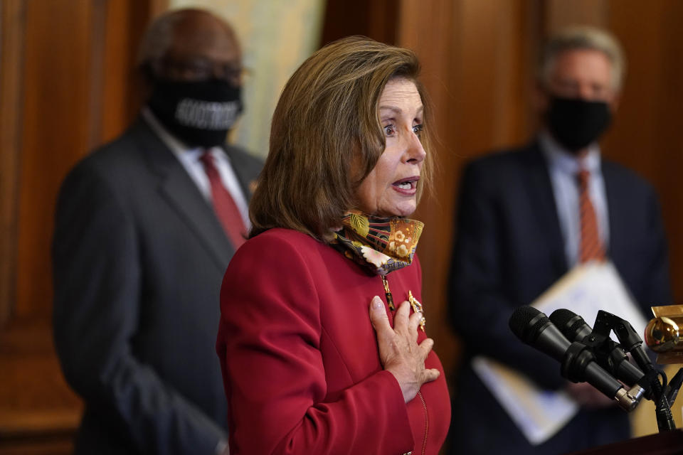 House Speaker Nancy Pelosi of Calif., center, with House Democrats including House Majority Whip James Clyburn, of S.C., left, and Chairman of the House Energy and Commerce Committee Rep. Frank Pallone, D-N.J., speaks during a news conference about COVID-19, Thursday, Sept. 17, 2020, on Capitol Hill in Washington. (AP Photo/Jacquelyn Martin)