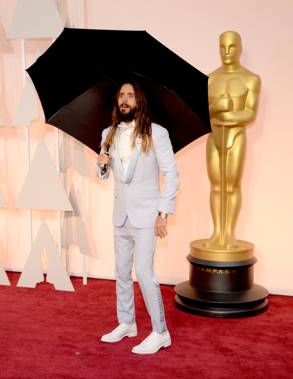 It rarely rains in Los Angeles so when it does, many are unprepared for the moisture. But Jared Leto was on top of his wet weather game with an umbrella on the red carpet to protect his beautiful blow out from the elements.