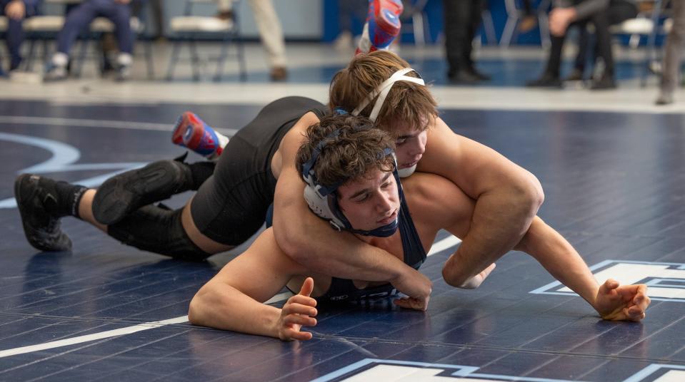 Christian Brothers Academy's Zander Silva (top) is shown during his 7-3 win over Middletown South's Alex Quintano Wednesday night. CBA won the match 37-24.