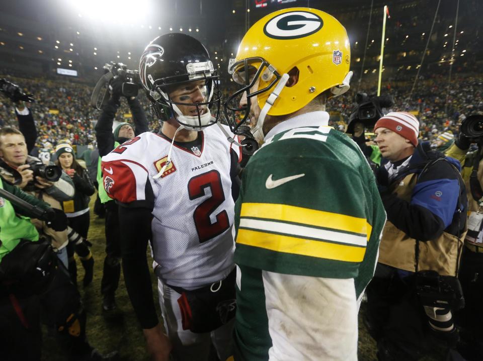 FILE - In this Dec. 8, 2014, file photo, Atlanta Falcons quarterback Matt Ryan (2) talks to Green Bay Packers quarterback Aaron Rodgers after an NFL football game in Green Bay, Wis. The Packers and Falcons play in the NFC Championship on Sunday, Jan. 22, 2017, in Atlanta.(AP Photo/Mike Roemer, File)