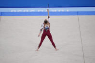 Sarah Voss, of Germany, performs her floor exercise routine during the women's artistic gymnastic qualifications at the 2020 Summer Olympics, Sunday, July 25, 2021, in Tokyo. (AP Photo/Gregory Bull)