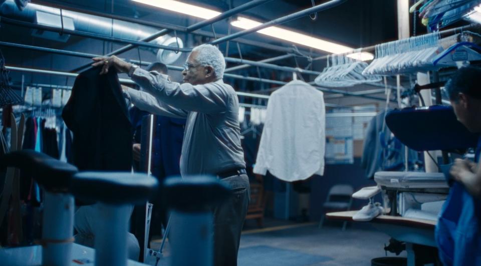 Horace Bowers handles a shirt at a dry cleaner in the Oscar-nominated documentary short "A Concerto Is a Conversation."