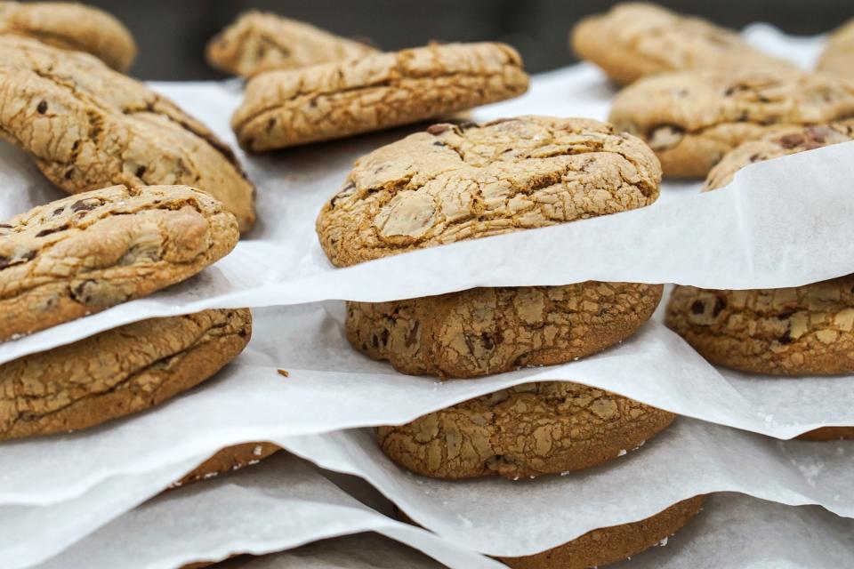 Chocolate chip cookies are stacked after being baked and are ready to be packaged at the industrial kitchen space for D'VINE Cookies in Taylor on January 4, 2023.