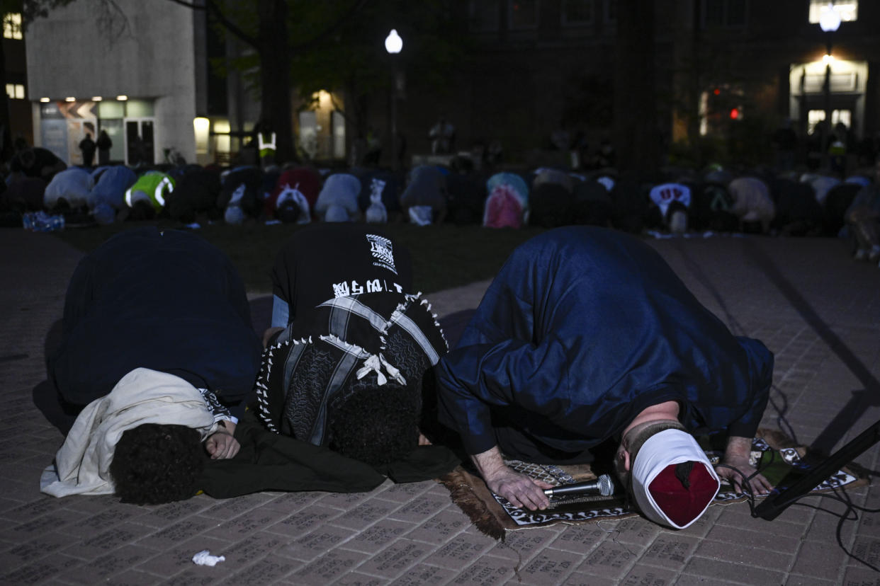 Students at George Washington University pray following a protest in support of Palestinians.