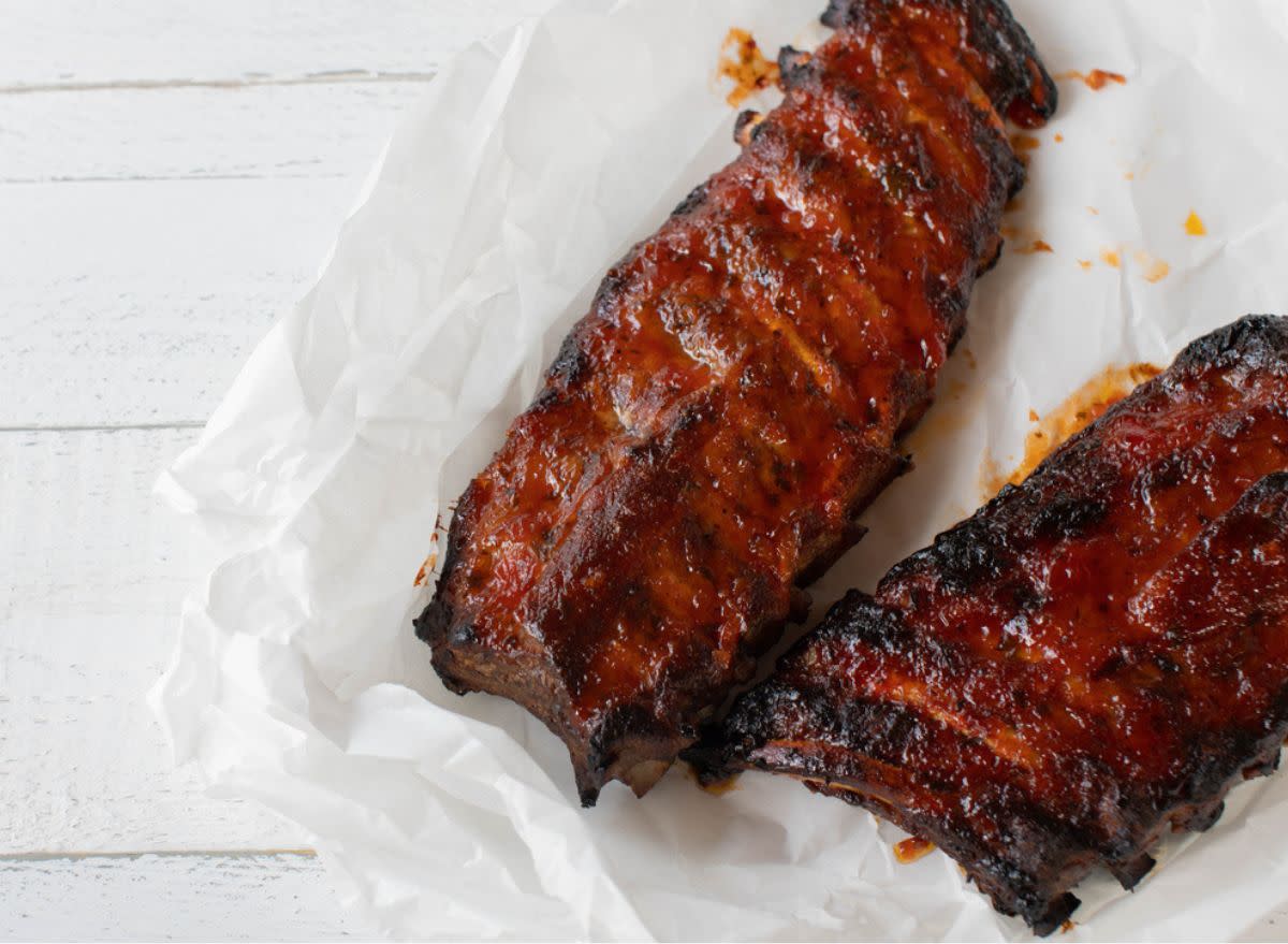 ribs with bbq sauce on a white table