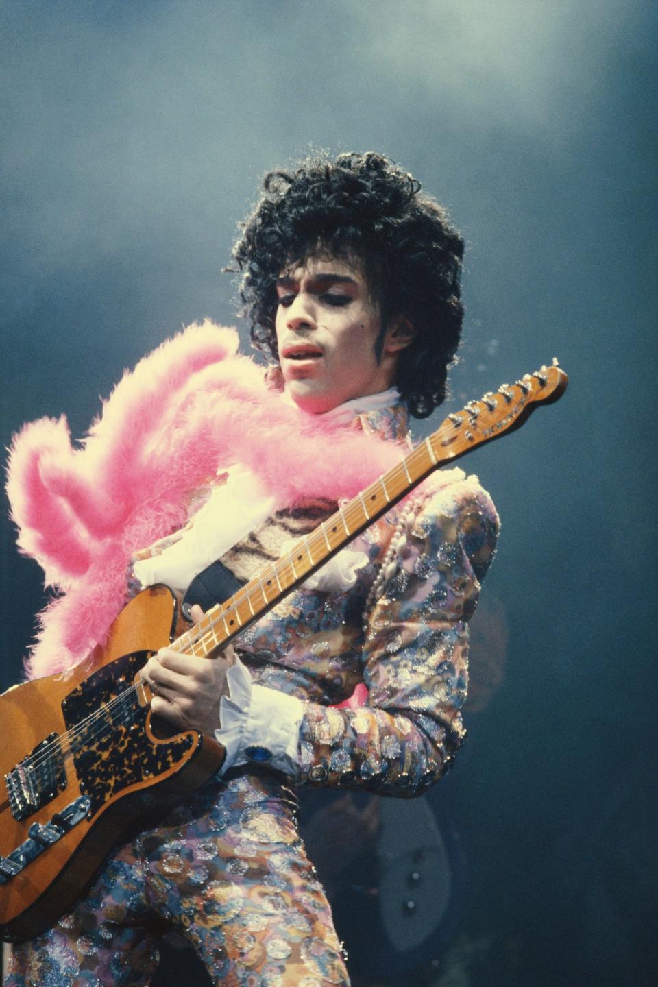 <p>Cuban heeled boots, co-ords, peasant blouses and, erm, bottomless-trousers were just some of the iconic pieces inside Prince’s outrageous wardrobe, which defied gender expectations magnificently. [Photo: Getty] </p>