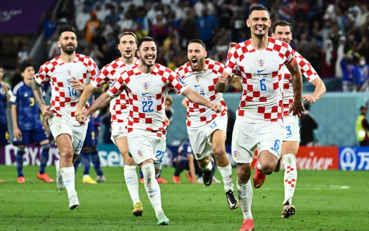 Croatia celebrate their penalty shootout win/Last 16 World Cup 2022: Which teams are left, who is out and the knockout fixtures - AFP