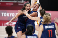 Serbia's Sonja Vasic, left, and Ana Dabovic celebrate at the end of a women's basketball quarterfinal round game against China at the 2020 Summer Olympics, Wednesday, Aug. 4, 2021, in Saitama, Japan. (AP Photo/Charlie Neibergall)