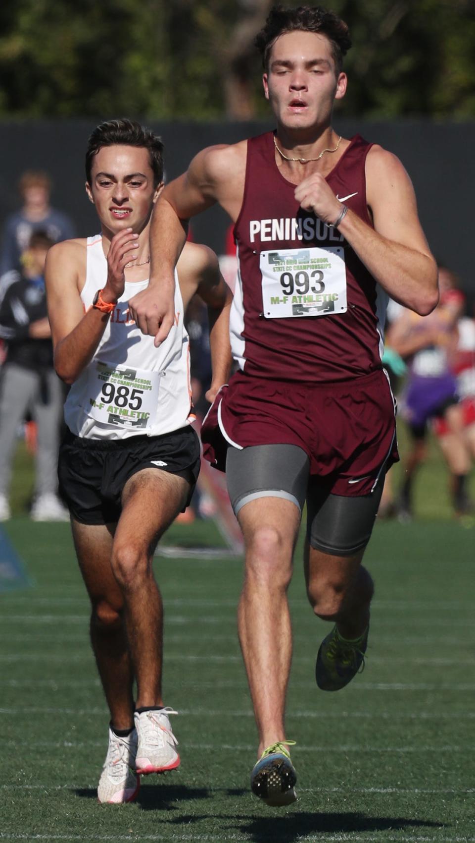 Woodridge Seth Singer outruns Marlington Nash Minor in the Div. II Boys Cross Country Championship at Fortress Obetz and Memorial Park in Obetz.