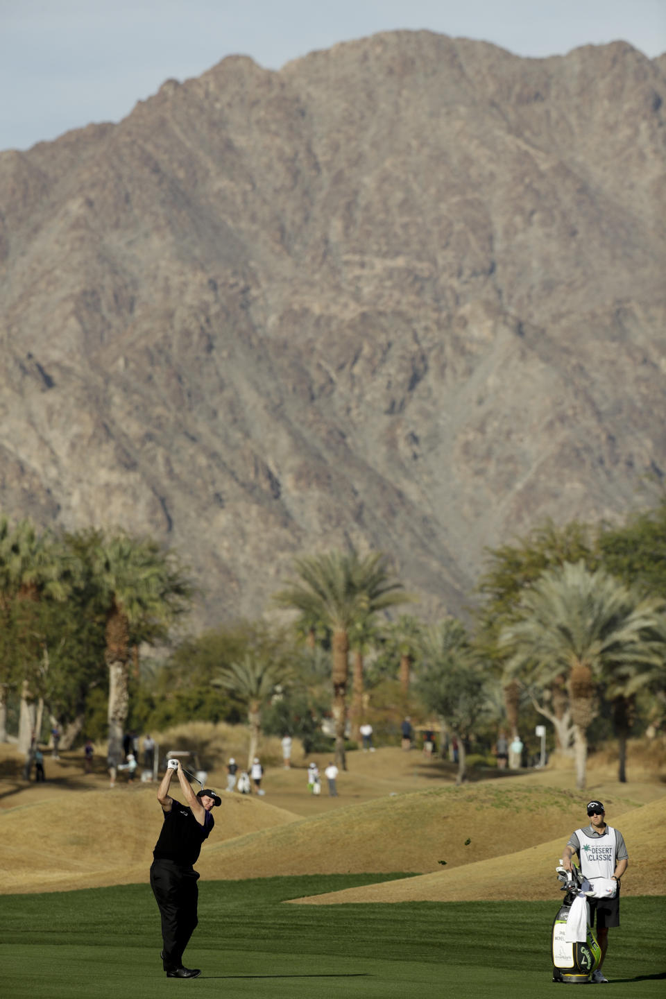 Phil Mickelson hits from the fairway on the 11th hole during the second round of the Desert Classic golf tournament on the Nicklaus Tournament Course at PGA West on Friday, Jan. 18, 2019, in La Quinta, Calif. (AP Photo/Chris Carlson)