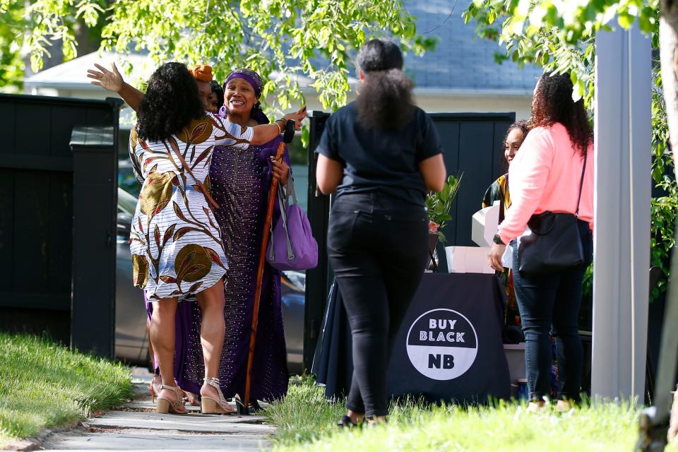 Guests greet each other as they arrive for the Buy Black NB event held at the Rotch-Jones-Duff House in New Bedford.