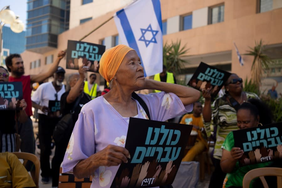 Members of the Hebrew Israelite community rally outside of the District Court in Beersheba, Israel, ahead of a hearing on the deportation orders for dozens from their community, Wednesday, July 19, 2023. The community’s decades-long plight to secure their status shines a light on Israel’s strict immigration policy, which grants people whom it considers Jewish automatic citizenship but limits entry to others who don’t fall within that definition. (AP Photo/Maya Alleruzzo)