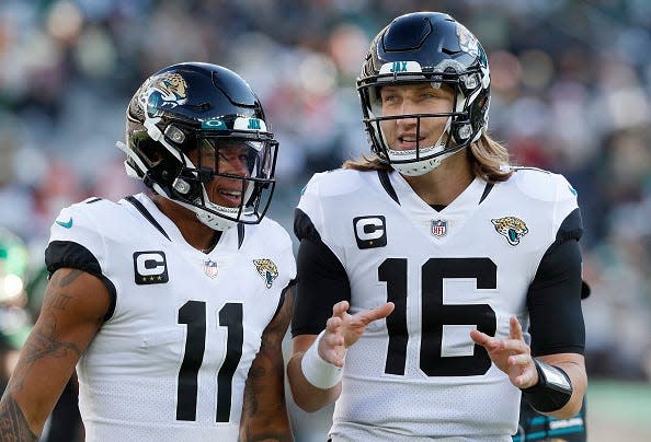 Trevor Lawrence and Marvin Jones of the Jacksonville Jaguars.