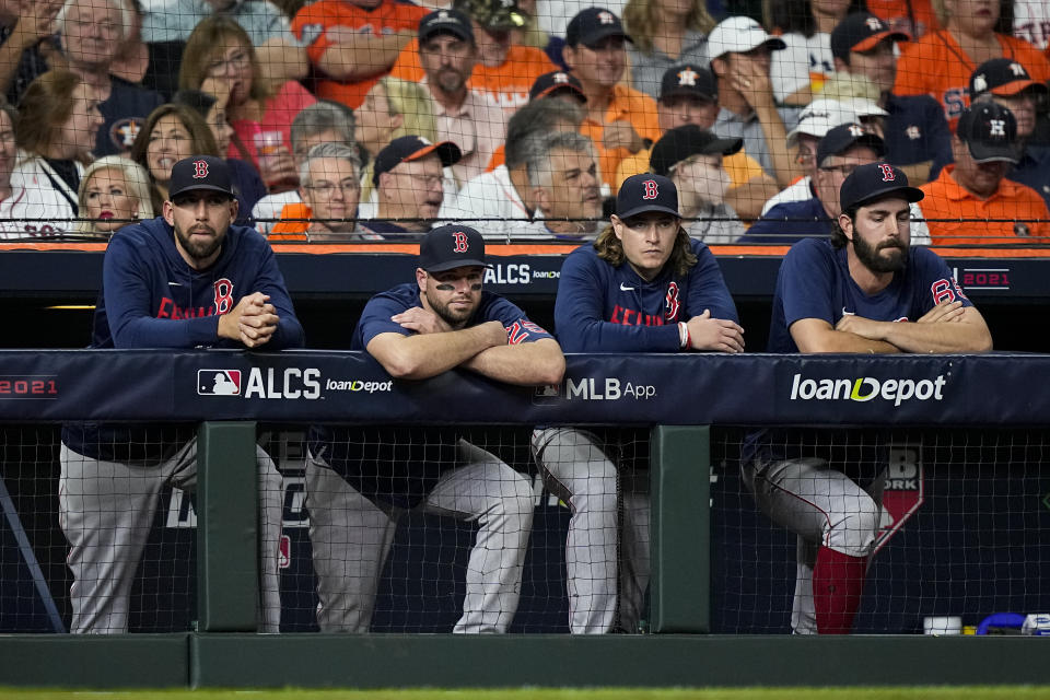 Members of the Boston Red Sox watch during the eighth inning in Game 6 of baseball's American League Championship Series against the Houston Astros Friday, Oct. 22, 2021, in Houston. (AP Photo/David J. Phillip)
