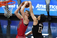 Milwaukee Bucks forward Jordan Nwora, right, blocks a shot by Chicago Bulls forward Lauri Markkanen during the first half of an NBA basketball game in Chicago, Sunday, May 16, 2021. (AP Photo/Nam Y. Huh)