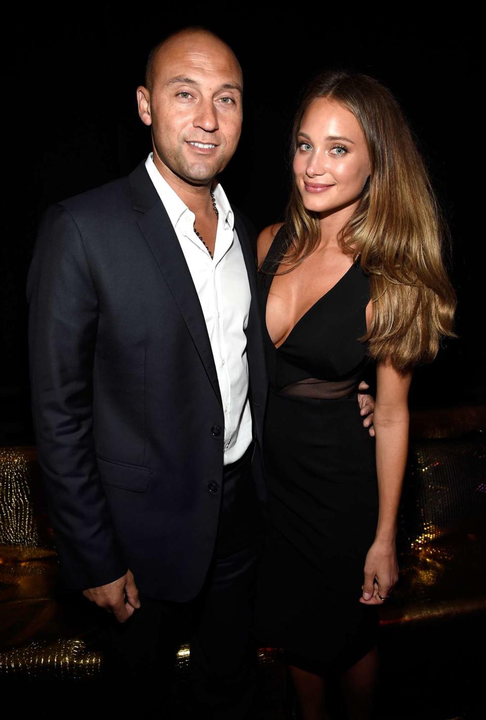 Derek Jeter (L) and model Hannah Davis attend DirecTV Super Saturday Night hosted by Mark Cuban's AXS TV and Pro Football Hall of Famer Michael Strahan at Pendergast Family Farm on January 31, 2015 in Glendale, Arizona