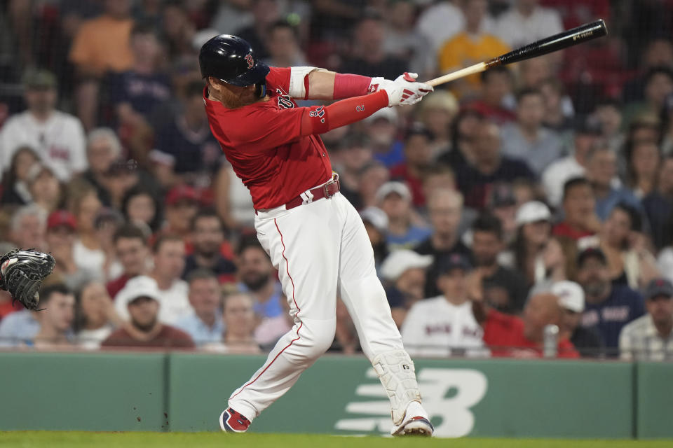 Boston Red Sox's Justin Turner hits an RBI single against the Cincinnati Reds during the fourth inning of a baseball game Thursday, June 1, 2023, in Boston. (AP Photo/Steven Senne)
