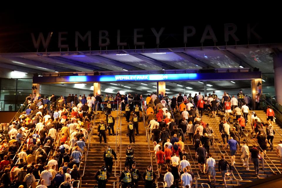 England fans outside Wembley Park station after the Uefa Euro 2020 final defeat (Zac Goodwin/PA) (PA Wire)