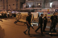 Police secure the site where a a gunman opened fire in Bnei Brak, Israel, Tuesday, March 29, 2022. The circumstance of the deadly incident in the city east of Tel Aviv were not immediately clear. (AP Photo/Oded Balilty)