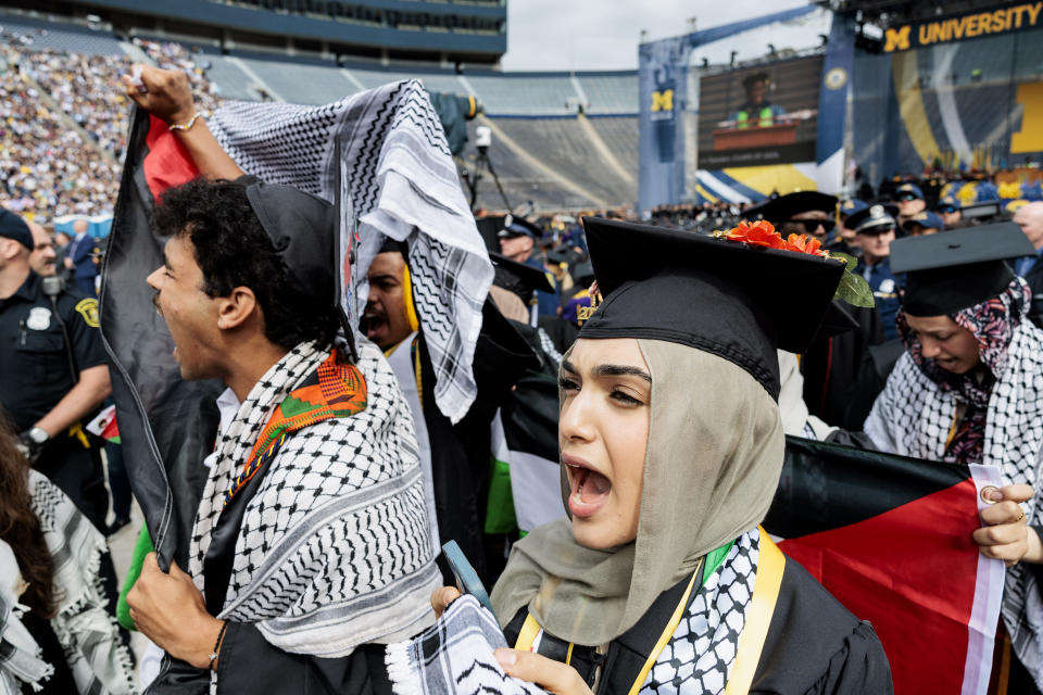 Pro-Palestinian protesters demonstrate during the University of Michigan's Spring 2024 Commencement Ceremony at Michigan Stadium in Ann Arbor, Mich., on Saturday, May 4, 2024.( Jacob Hamilton/Ann Arbor News via AP)