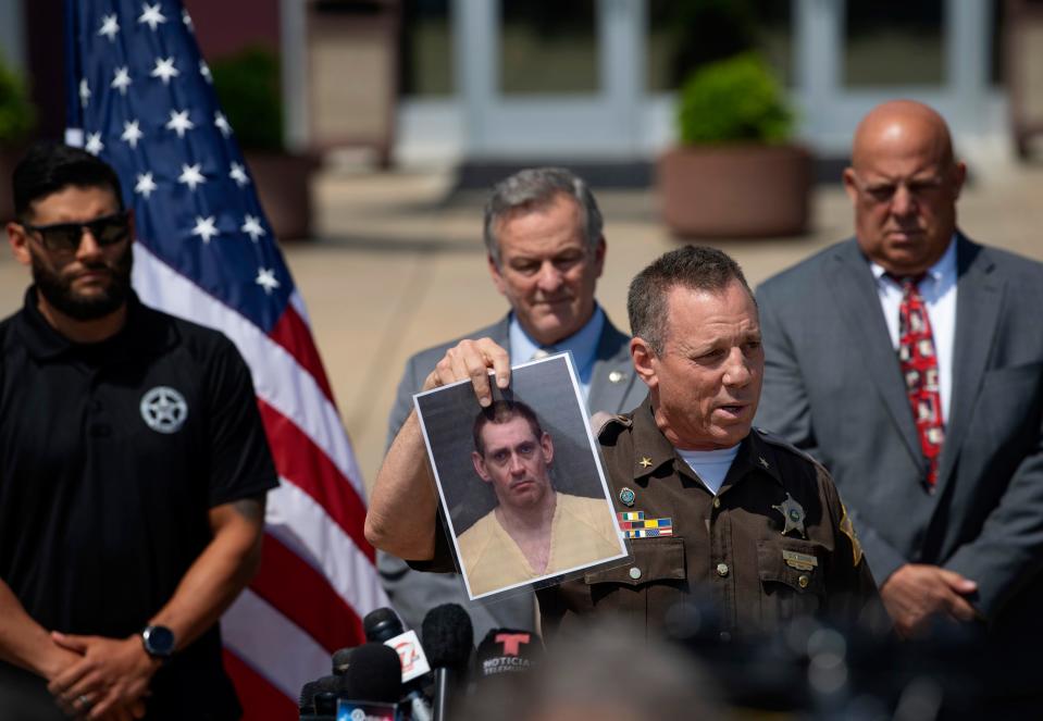 Former Vanderburgh Sheriff Dave Wedding displays a booking shot of Casey White during a press conference to discuss the capture of fugitives Casey White and Vicky White, no relation, during a vehicle chase along Hwy 41 the day before at the Vanderburgh County Sheriff's Office Tuesday morning, May 10, 2022. Vicky White reportedly died after shooting herself after their Cadillac sedan was stopped near Anchor Industries.