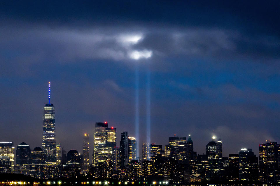 The annual Tribute in Light display illuminates clouds above Lower Manhattan on the 21st anniversary of 9/11 on Sunday, Sept. 11, 2022, in New York. (AP Photo/Julia Nikhinson)