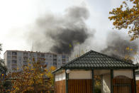 Smoke rises after multiple rocket system shelling by Armenian forces in Barda, Azerbaijan, Wednesday, Oct. 28, 2020. The Azerbaijani Defense Ministry rejected all the accusations and in turn accused Armenian forces of using the Smerch multiple rocket system to fire at the Azerbaijani towns of Terter and Barda. The strike on Barda killed more than 20 people and wounded 60, Azerbaijani officials said. (AP Photo/Aziz Karimov)