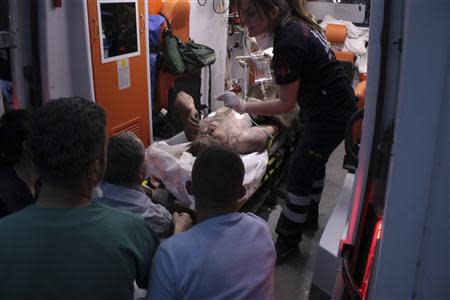 An injured miner is carried into a hospital in Soma, a district in Turkey's western province of Manisa May 13, 2014. REUTERS/Depo Photos