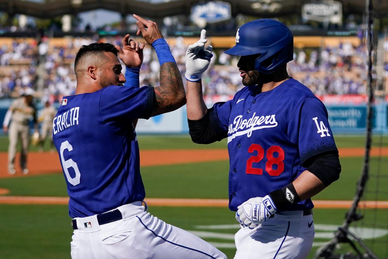 David Peralta and J.D. Martinez celebrate a home run against the Padres on Saturday at Dodger Stadium.