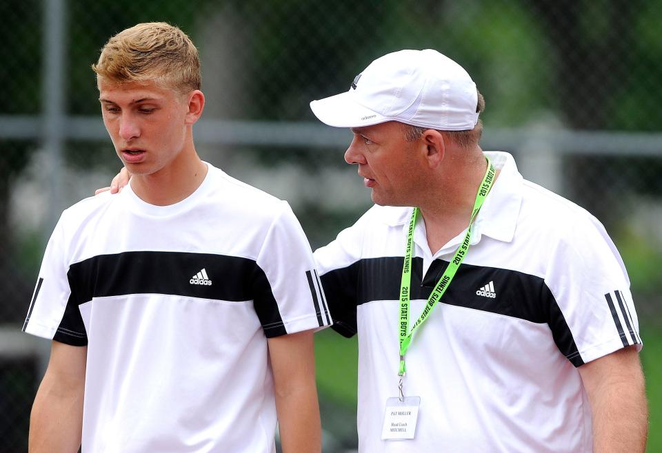 Mitchell's Beau Brown listens as his coach Pat Moller talks with him during a break from playing O'Gorman's Jake Moran during boys state tennis at McKannen Park in Sioux Falls, S.D., Saturday, May 23, 2015. 