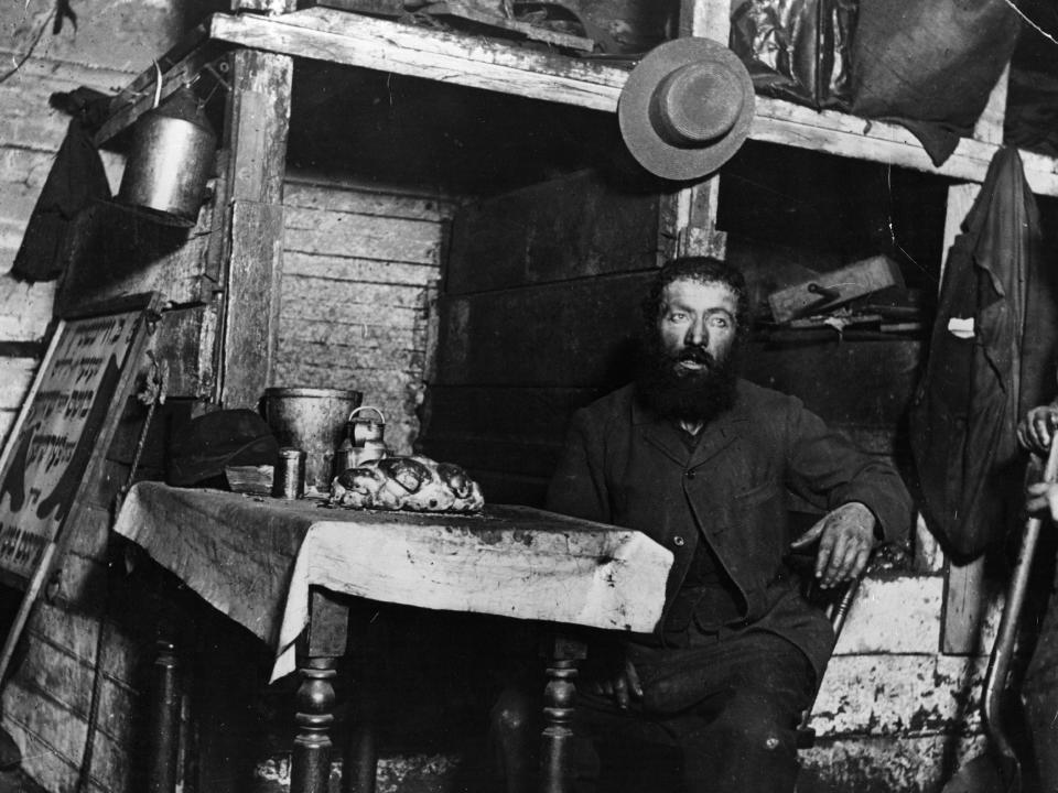 A Jewish cobbler in a coal cellar in New York, where he was living with his family in 1887.