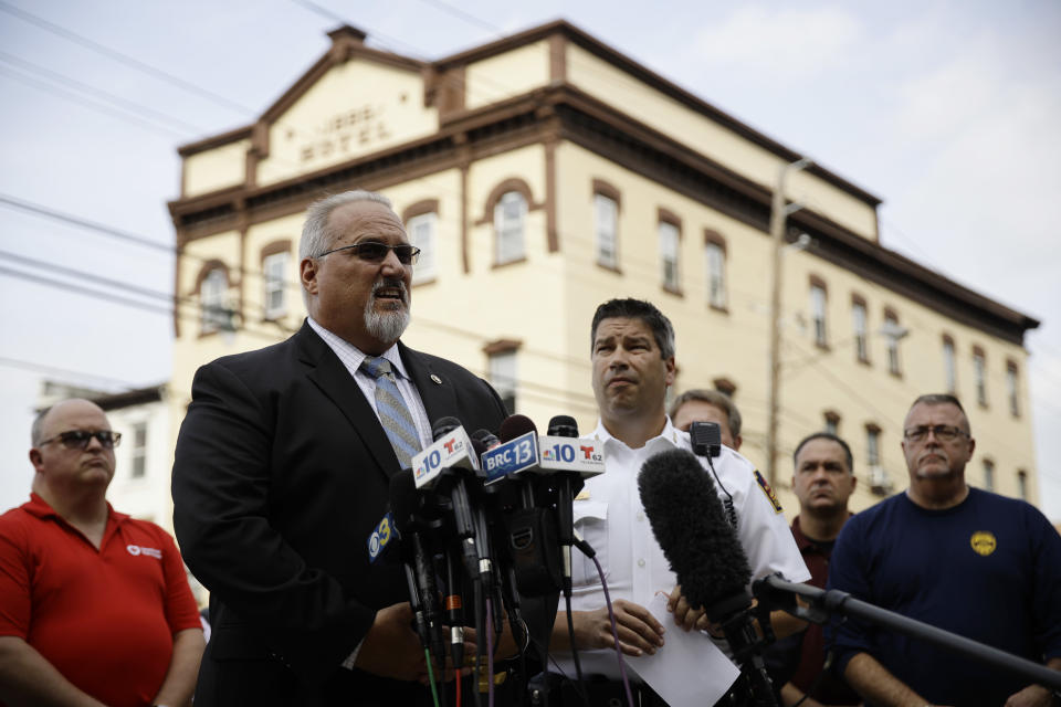 Bureau of Alcohol, Tobacco, Firearms and Explosives special agent in charge Don Robinson, center left, accompanied by Allentown Police Chief Tony Alsleben, center right, speaks with members of the media near the scene of Saturday's fatal car explosion in Allentown, Pa., Monday, Oct. 1, 2018. (AP Photo/Matt Rourke)