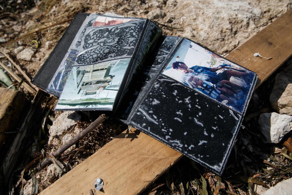 <p>Wet family album sits out to dry in the Sea Breeze trailer park that was destroyed by Hurricane Irma, in Islamorada, Florida Keys, on Sept. 12, 2017. (Photo: Marcus Yam/Los Angeles Times via Getty Images) </p>