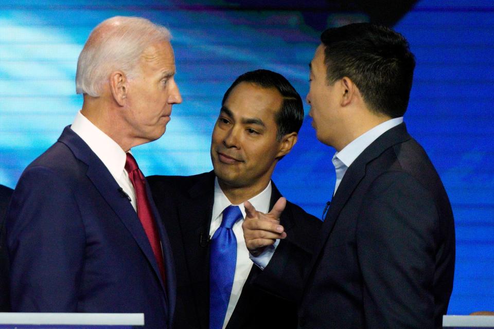 From left, Democratic presidential candidates Joe Biden, Julian Castro and Andrew Yang talk on Sept. 12, 2019, after the debate in Houston.